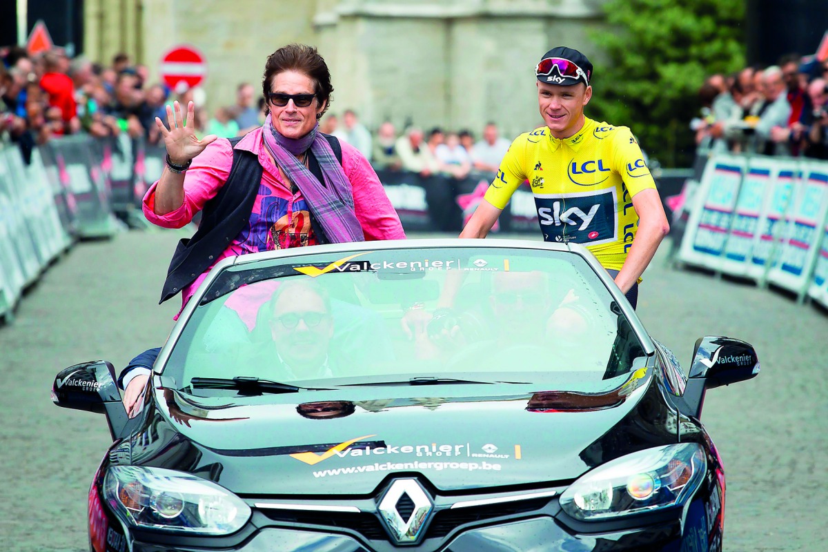 US actor Ronn Moss (left) and British cyclist Chris Froome ride in a car before the start of the 82nd edition of the ‘Natourcriterium Aalst’ cycling race in Aalst on Monday. 