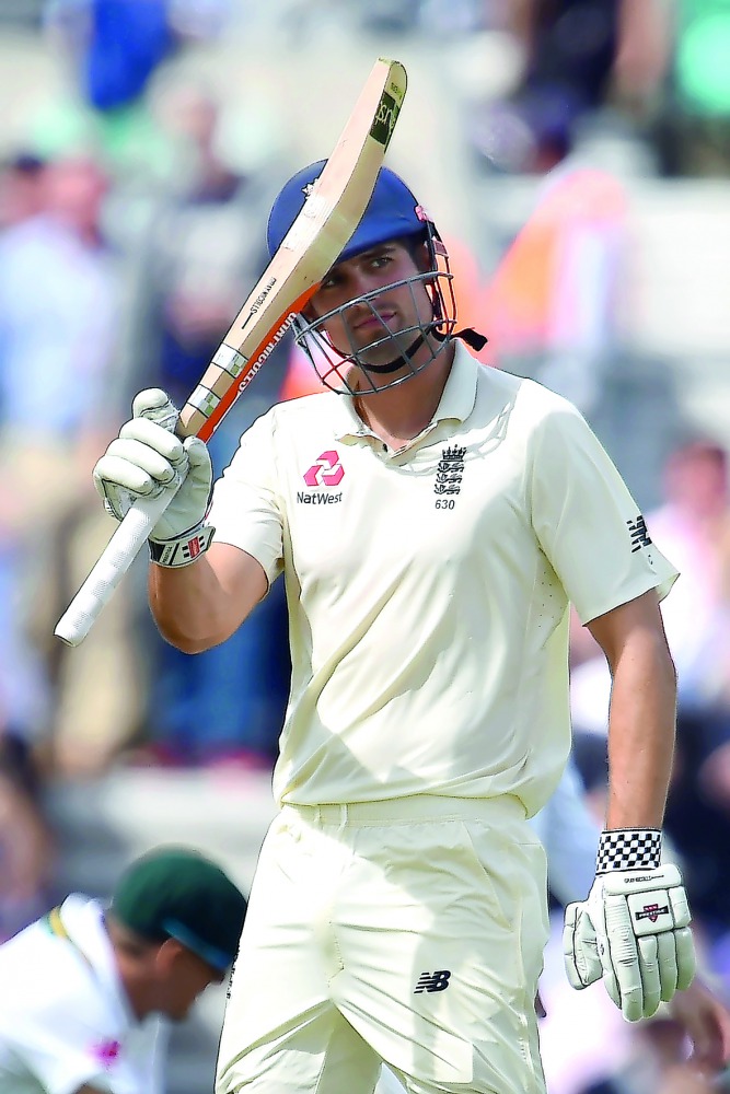 England’s Alastair Cook celebrates his half century on the first day of the third Test against South Africa at the Oval in London, yesterday.