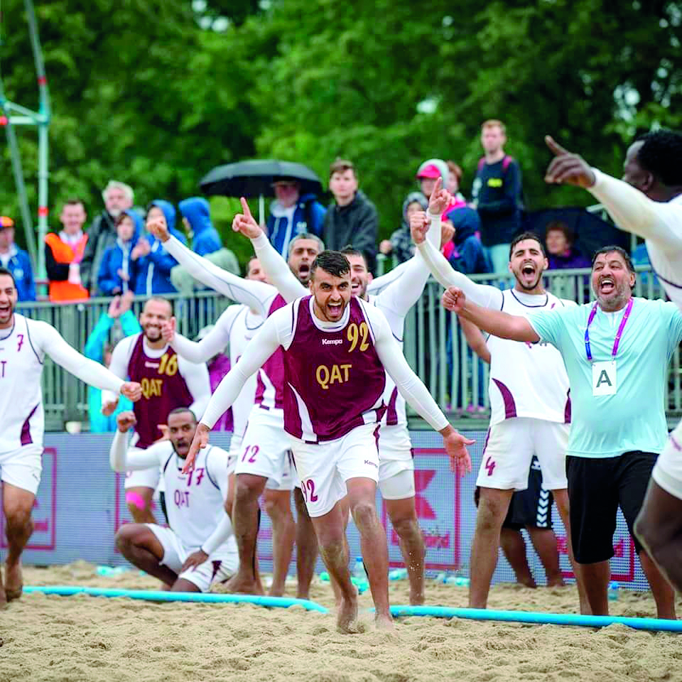 Qatari beach handball players celebrate after scoring against Hungary in the bronze medal match of the 10th World Games in Wroclaw, Poland yesterday. 