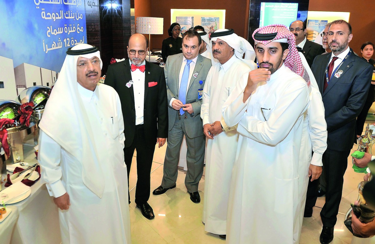 Sheikh Fahad bin Mohammad bin Jabor Al Thani (fourth left), Chairman of the Board of Directors;  Sheikh Abdul Rehman bin Mohammad bin Jabor Al Thani (left), Managing Director and Dr R Seetharaman (second left), Chief Executive Officer, Doha Bank with othe