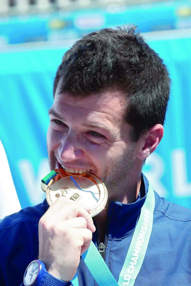Gold medalist Steve LoBue celebrates on the podium of the men’s high diving competition at the 2017 FINA World Championships in Budapest, yesterday. 
