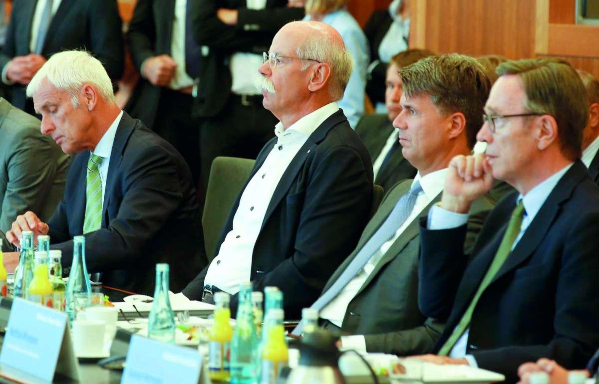 FROM RIGHT: Matthias Wissmann, President of the German Automobile Industry Association; Harald Krueger, CEO, BMW; Dieter Zetsche, CEO, Daimler AG; and Matthias Mueller, CEO, Volkswagen at the meeting  with German federal ministers in Berlin, yesterday.