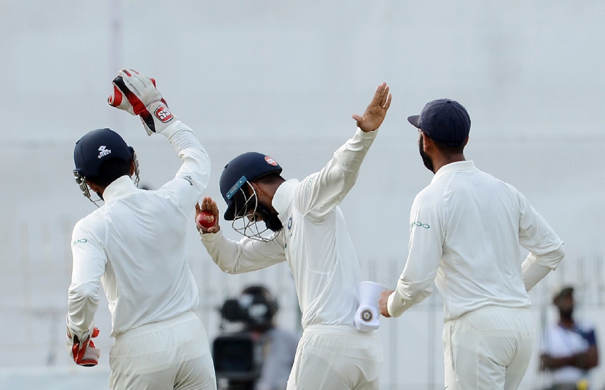 Indian cricketer Lokesh Rahul (C) celebrates with his teammates after takes a catch to dismiss Sri Lankan cricketer Upul Tharanga during the second day of the second Test match between Sri Lanka and India at the Sinhalese Sports Club (SSC) Ground in Colom