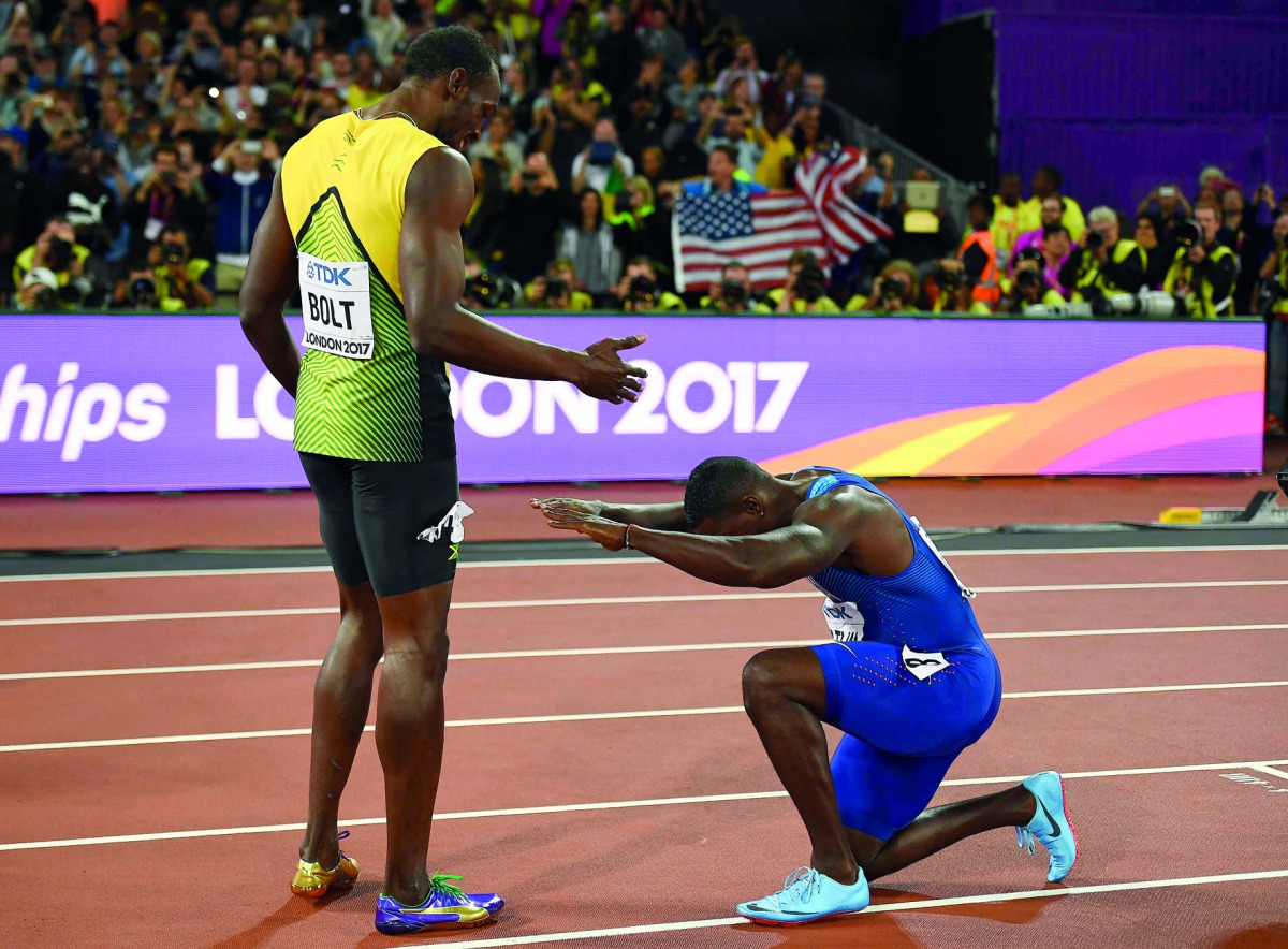 Justin Gatlin of the US bows to third placed Usain Bolt of Jamaica after winning the race.