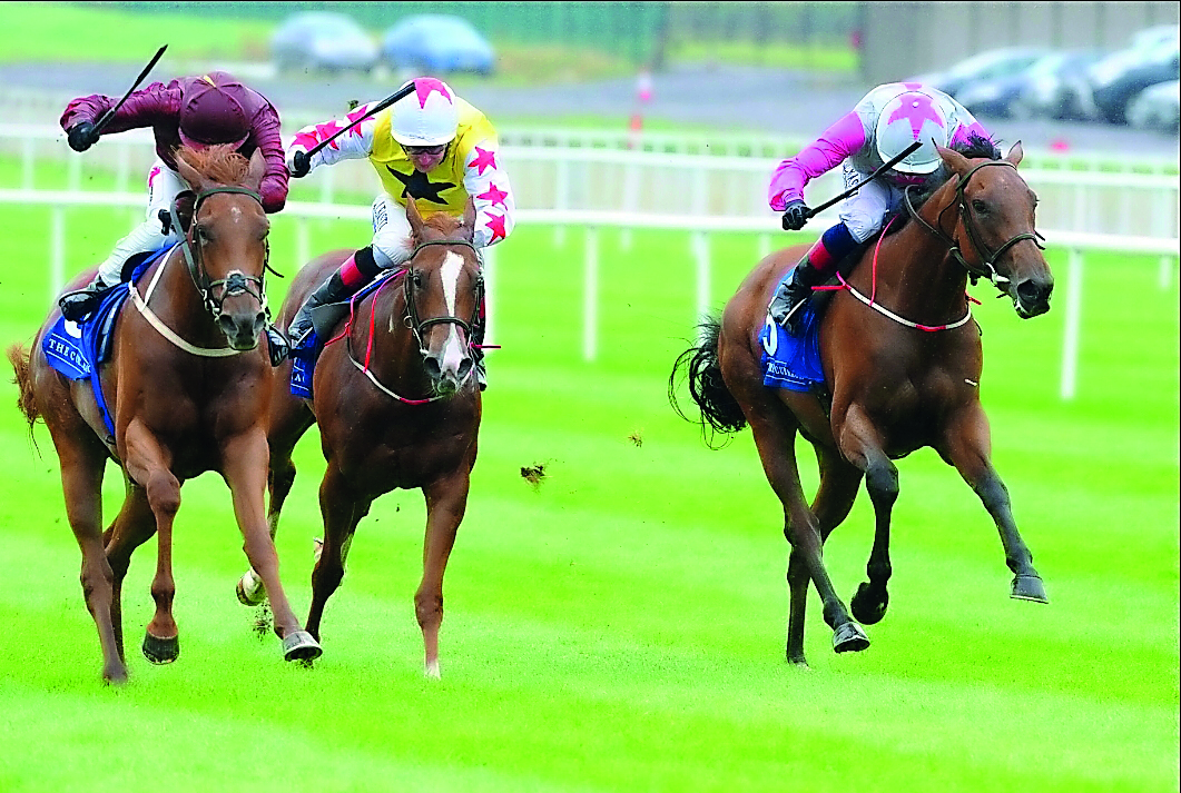 Jockey Ger Lyons guiding Treasuring (left) towards the victory in the Group three Qatar Racing & Equestrian Club (QREC) Curragh Stakes at the Curragh Racecourse in Ireland on Sunday.