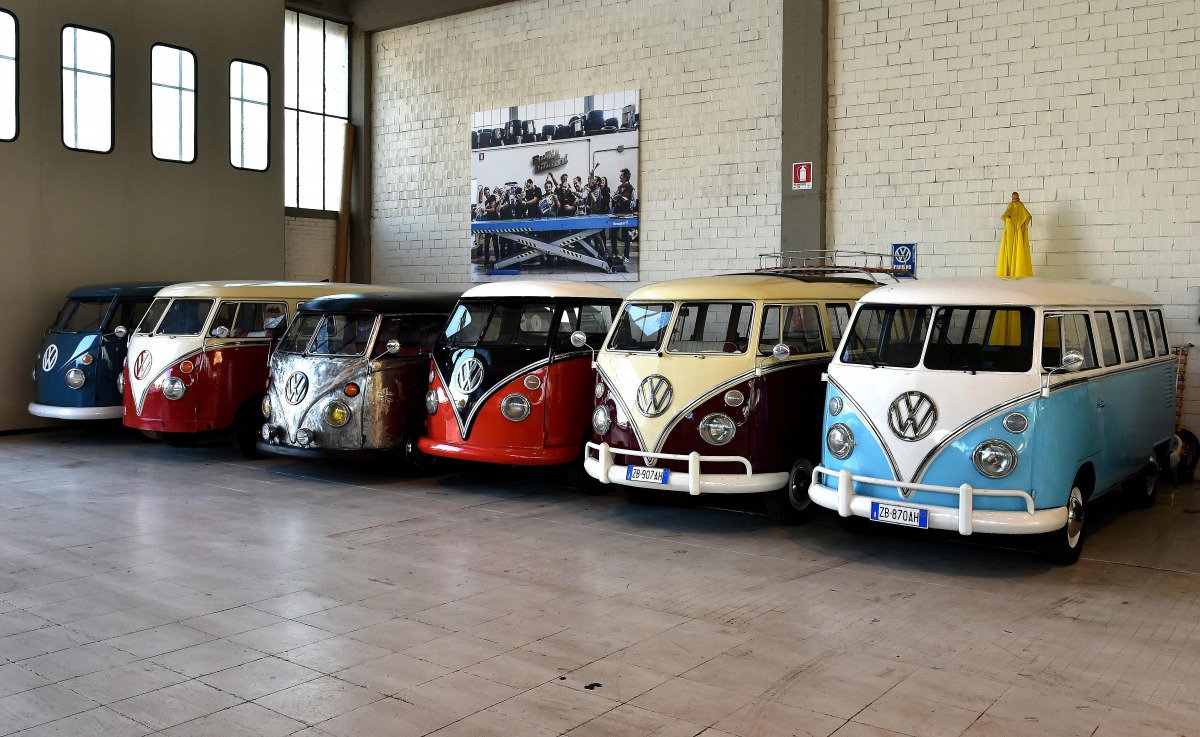 Vintage Volkswagen Kombi bus are parked in a garage after being completly restored by mechanics of the T1 specialist company on November 3. 2016 in Florence (AFP)