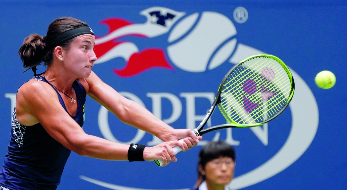 Anastasija Sevastova of Latvia returns the ball to Maria Sharapova of Russia during their fourth round match of the US Open on Sunday. The Latvian 16th seed Sevastova rallied to eliminate the five-time Grand Slam champion 5-7, 6-4, 6-2 and advanced to the