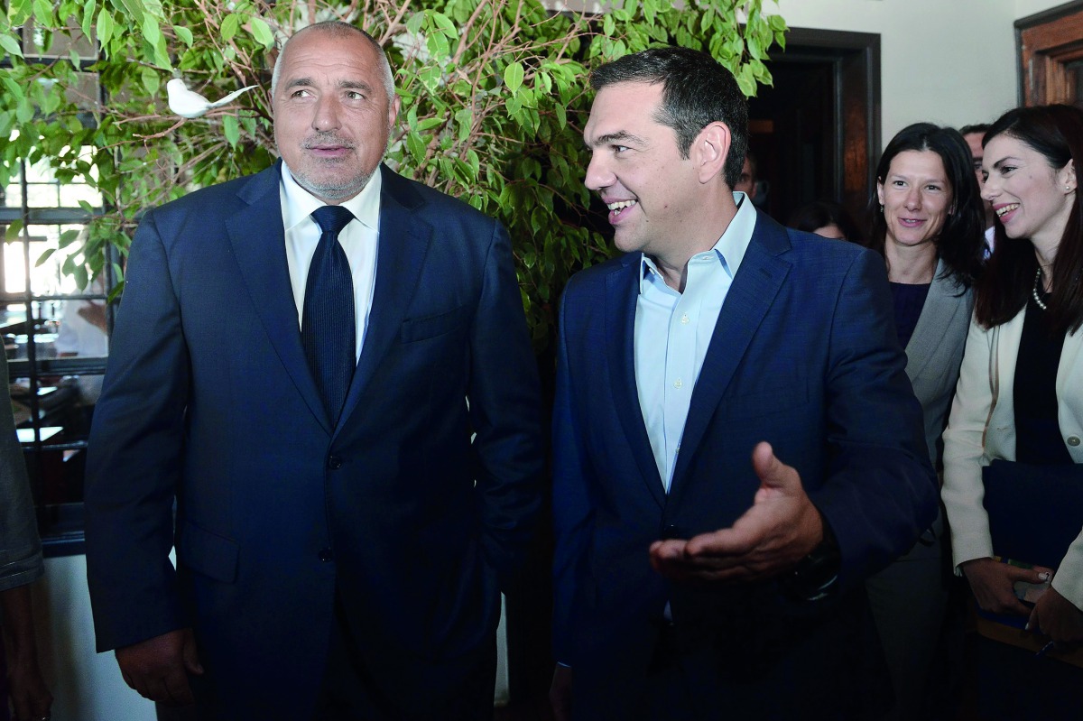 Greek Prime Minister Alexis Tsipras (R) and his Bulgarian counterpart Boyko Borissov (L) are pictured following the signing of a bilateral agreement to speed up the planned construction of a railway network that will connect Black Sea ports with those of 
