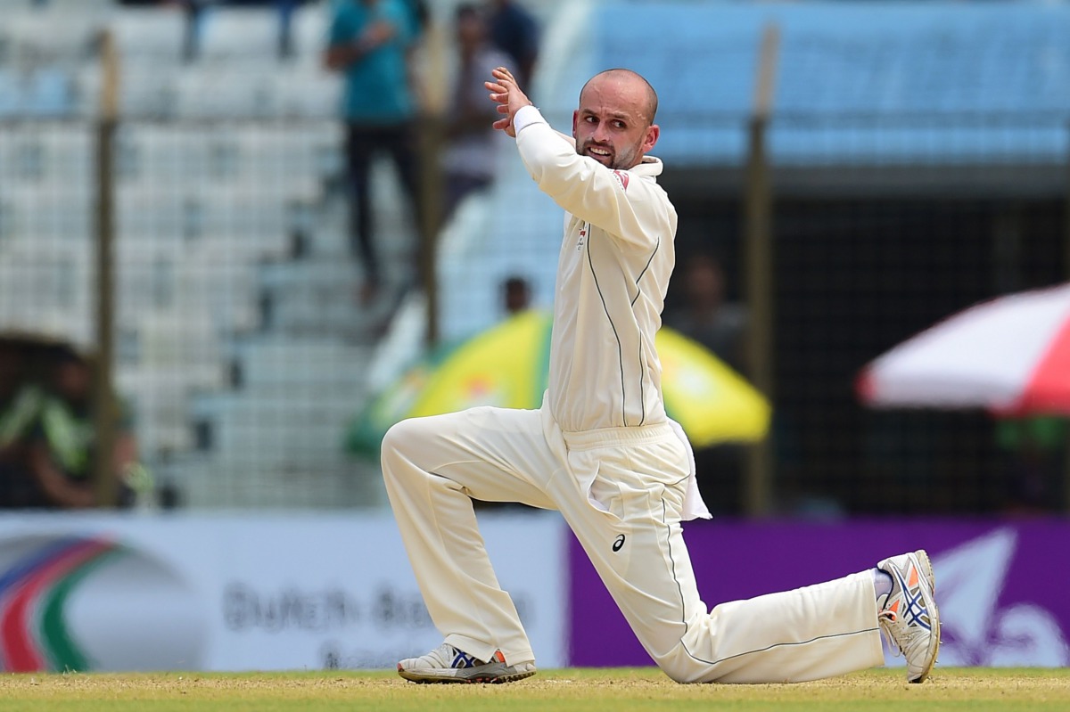 Australian cricketer Nathan Lyon appeals unsuccessfully for a leg before wicket decision against Bangladeshi cricketer Nasir Hossain during the second day of the second cricket Test match between Bangladesh and Australia at Zahur Ahmed Chowdhury Stadium i