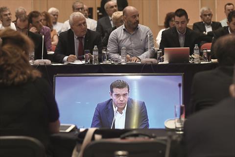 Greek Prime Minister Alexis Tsipras (right) speaks during a press conference at the Thessaloniki International Fair (TIF) in Thessaloniki, northern Greece, yesterday. Tsipras said attracting investment was a priority for his leftist-led government.