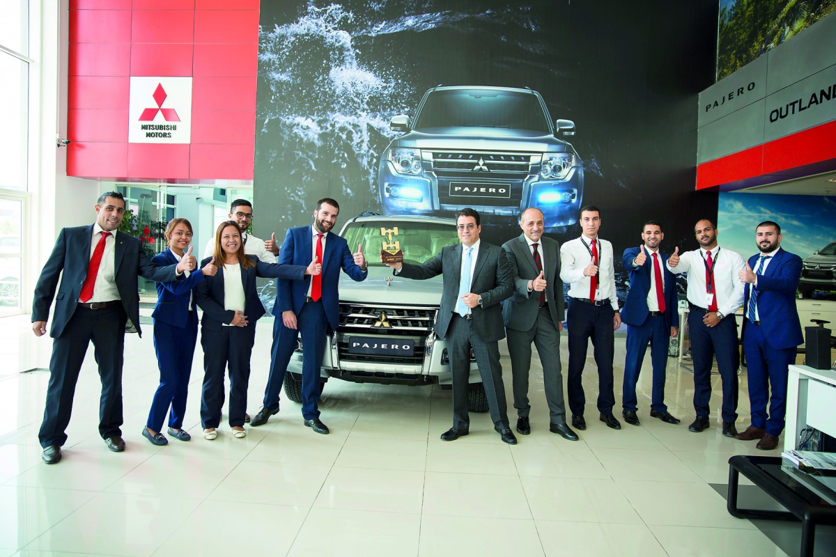 Qatar Automobile Company officials with the award.