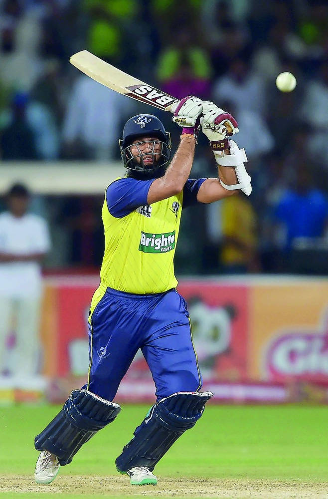 World XI batsman Hashim Amla plays a shot during the second Twenty20 international cricket match against Pakistan at the Gaddafi Cricket Stadium in Lahore, yesterday.