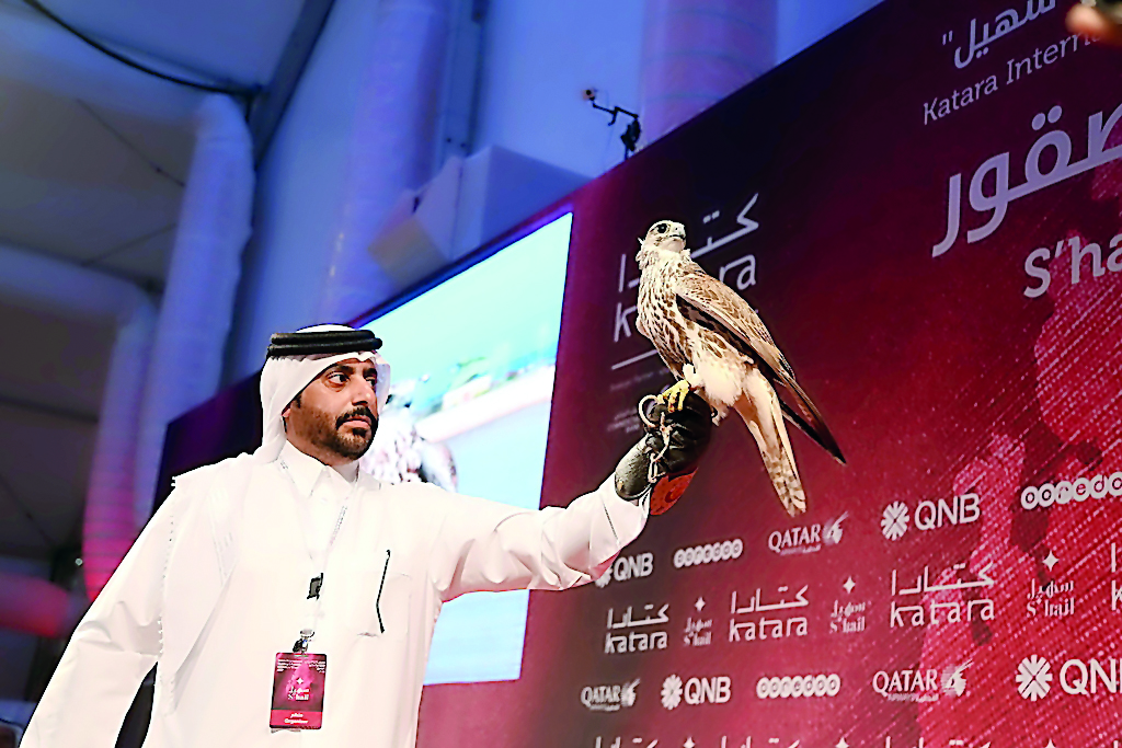 A participant with his falcon at the exhibition.