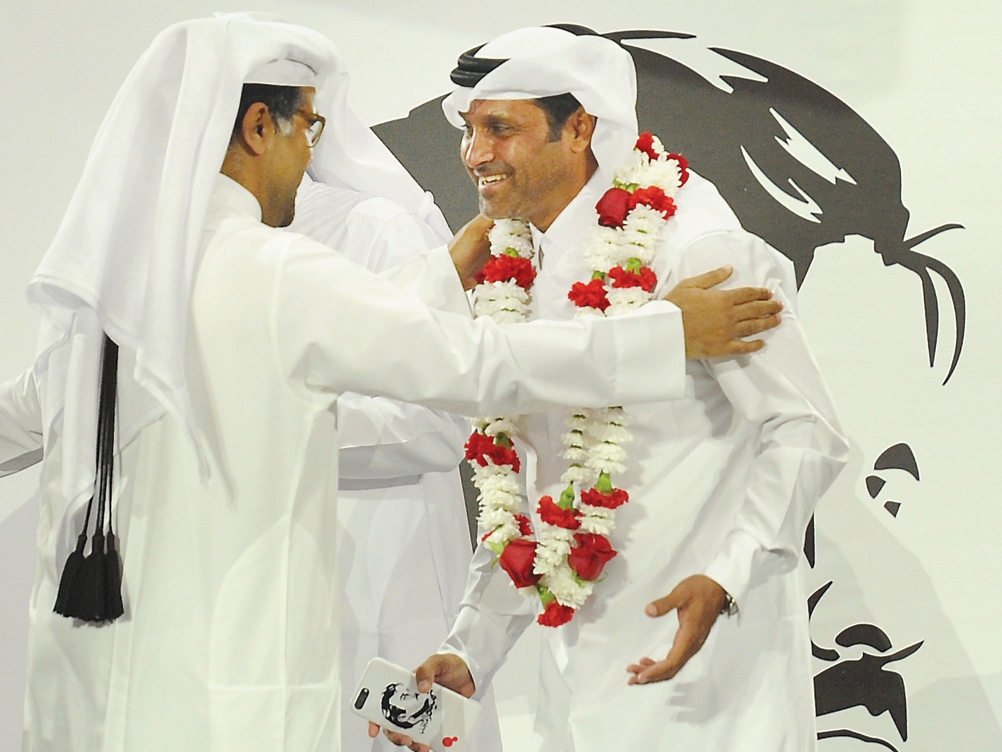 Qatar Motor and Motorcycle Federation (QMMF) President Abdulrahman Al Mannai (left) greets Qatar’s star rally driver Nasser Saleh Al Attiyah during a felicitation ceremony held on Thursday. (Photo: Salim Matramkot)
