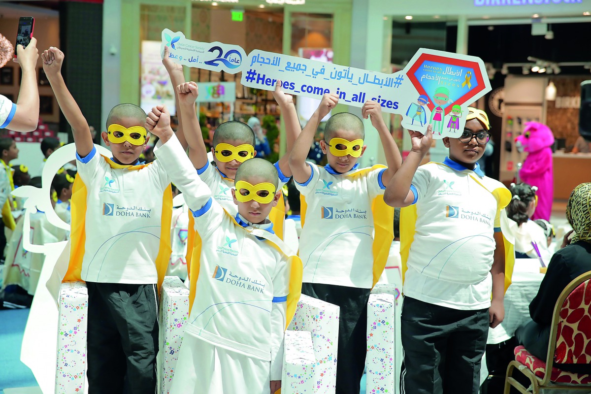 Children participating in the campaign “Heroes Come In All Sizes” organised by QCS to raise awareness about childhood cancer. 