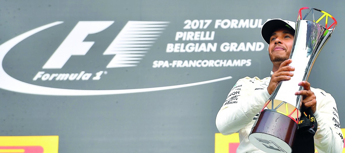 Mercedes’ British driver Lewis Hamilton celebrates on the podium after winning the Belgian Formula One Grand Prix in this August 2017 file picture.