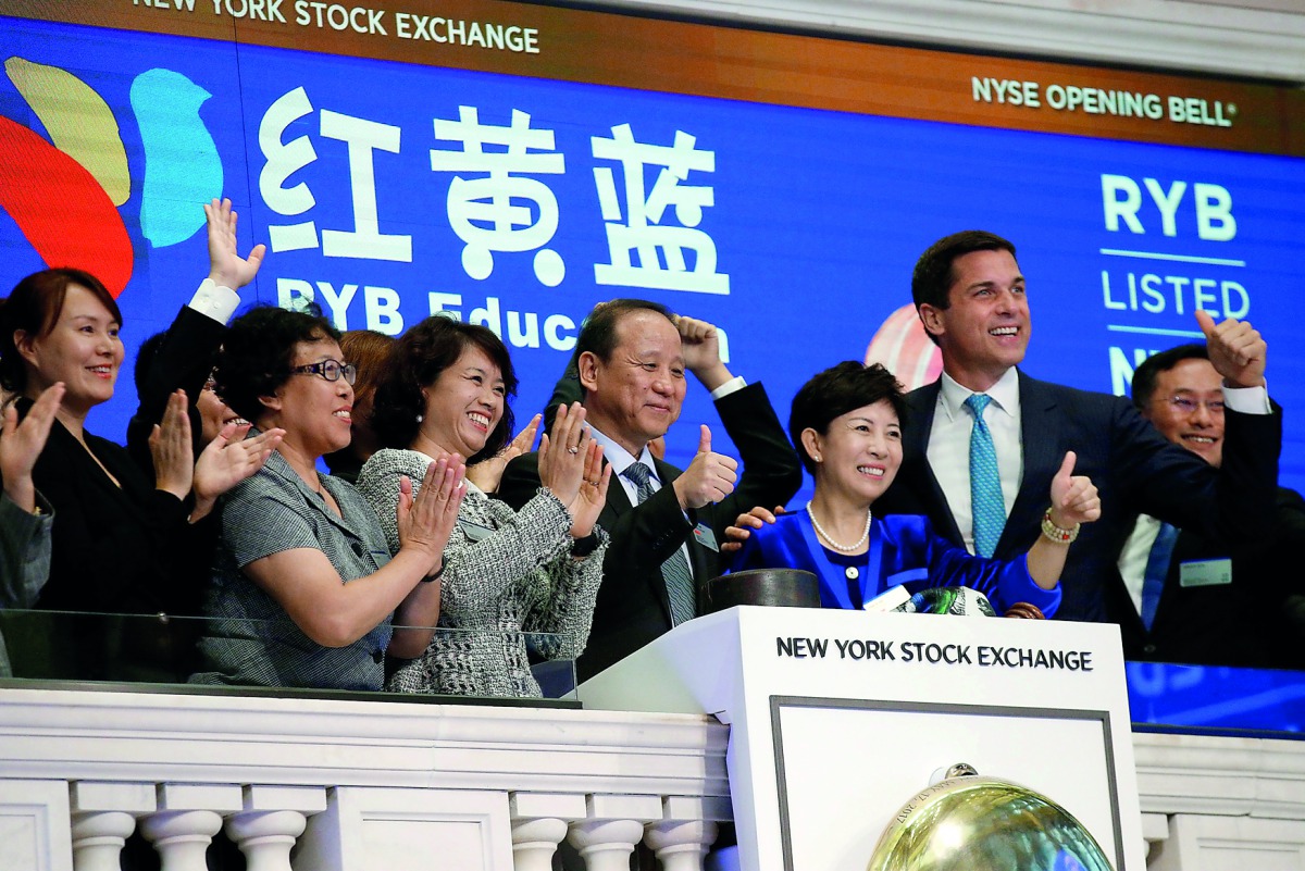 Chimin Cao, Co-Founder and Chairman for RYB Education Institution and Yanlai Shi, Co-Founder and CEO for RYB Education Institution, ring the opening bell together to celebrate their company’s IPO at the New York Stock Exchange (NYSE) in New York, yesterda