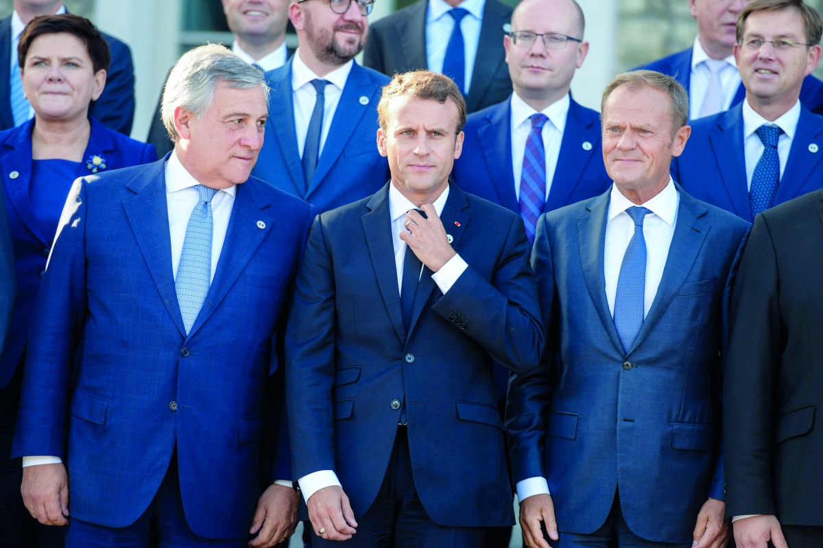 (Front row, L-R) The President of the European Parliament, Antonio Tajani, French President Emmanuel Macron and European Council President Donald Tusk and other participants pose for a family photo during a European Union summit in Tallinn, Estonia, on Se
