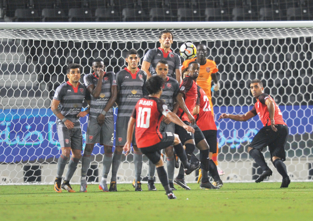 Al Rayyan’s Rodrigo Tabata shoots a free kick during their QNB Stars League match against Al Duhail at Al Sadd Stadium yesterday. Al Duhail beat Al Rayyan 5-3 in an eight-goal thriller.