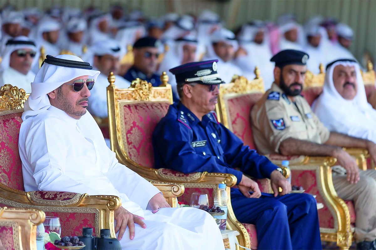 Prime Minister and Interior Minister H E Sheikh Abdullah bin Nasser bin Khalifa Al Thani and Staff Major General Saad bin Jassim Al Khulaifi, the Director-General of Public Security, and other officials at the graduation ceremony of the diving and parachu