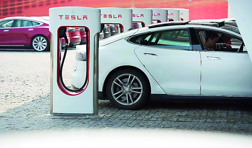This picture taken on March 17, 2015 shows a Tesla Model S being charged at a car dealership in Shanghai. Johannes Eisele/AFP/Getty Images