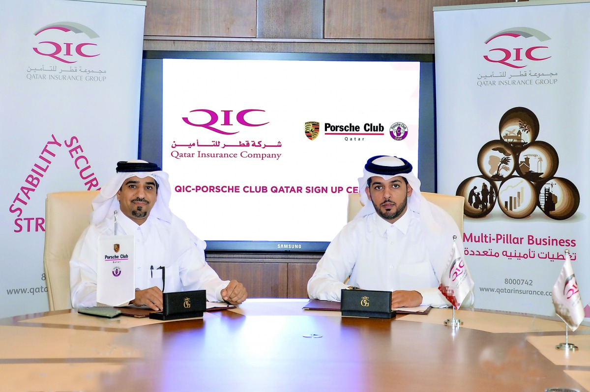 Salem Al Mannai (right), Deputy Group President and CEO, QIC Mena, with Khaled Al Remithi, Porsche Qatar Club President at the signing ceremony.