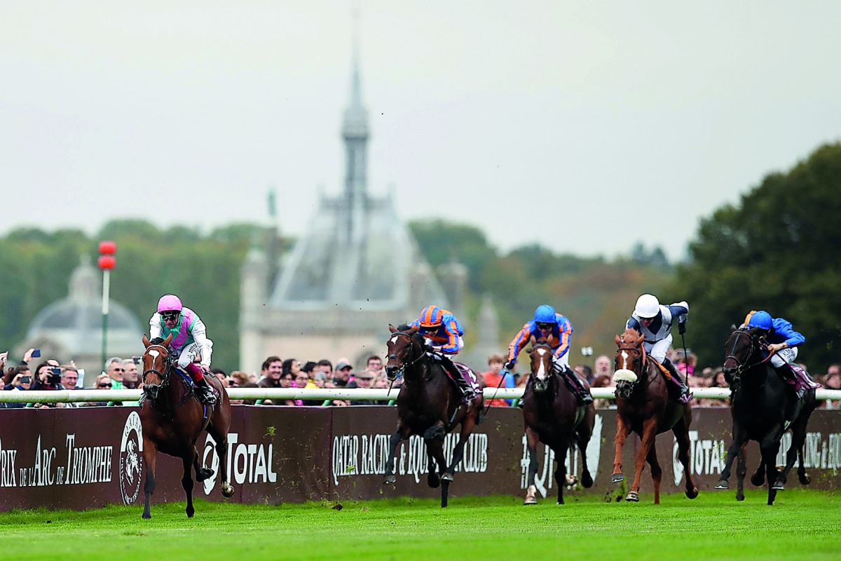 Jockey Frankie Dettori guides Enable (left) towards the victory in the Qatar Prix de l’Arc de Triomphe (Group 1) race at Chantilly Racecourse yesterday.