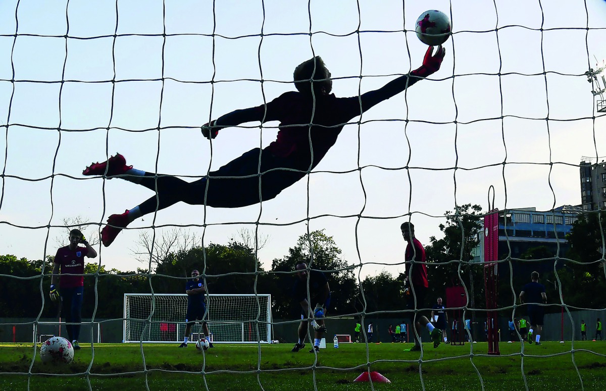 A goalkeeper with the U-17 English football team practises at the Sports Authority of India (SAI) Complex ahead of the forthcoming FIFA U-17 World Cup, in Kolkata on Wednesday.