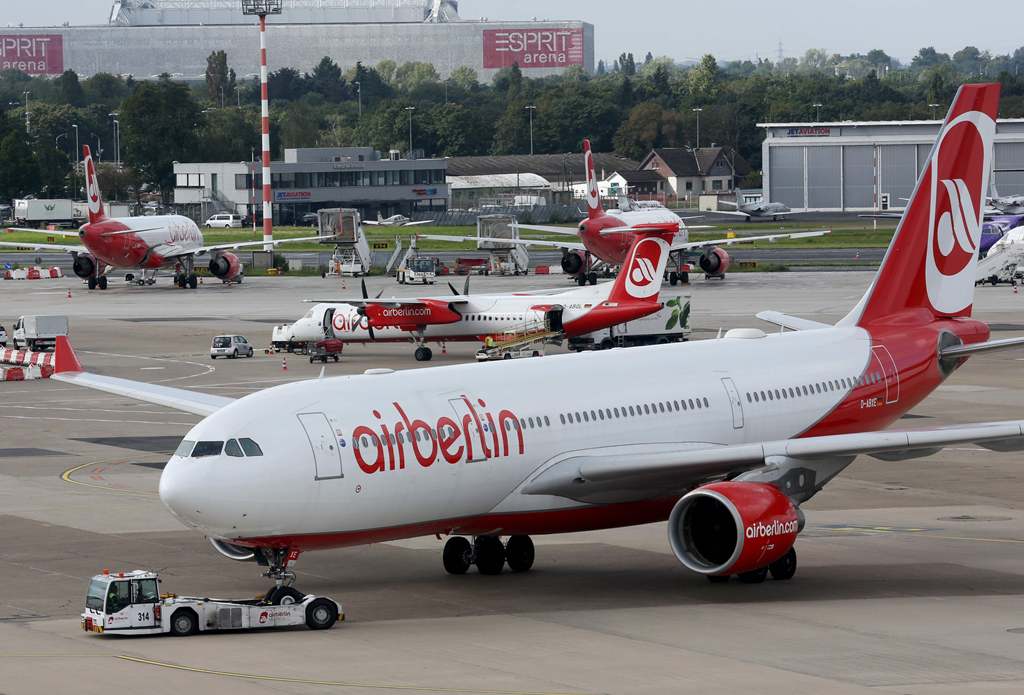 This file photo taken on September 12, 2017 shows aircrafts of German airline Air Berlin parked at the airport in Duesseldorf, western Germany, after the troubled airline had to cancel flights due to 