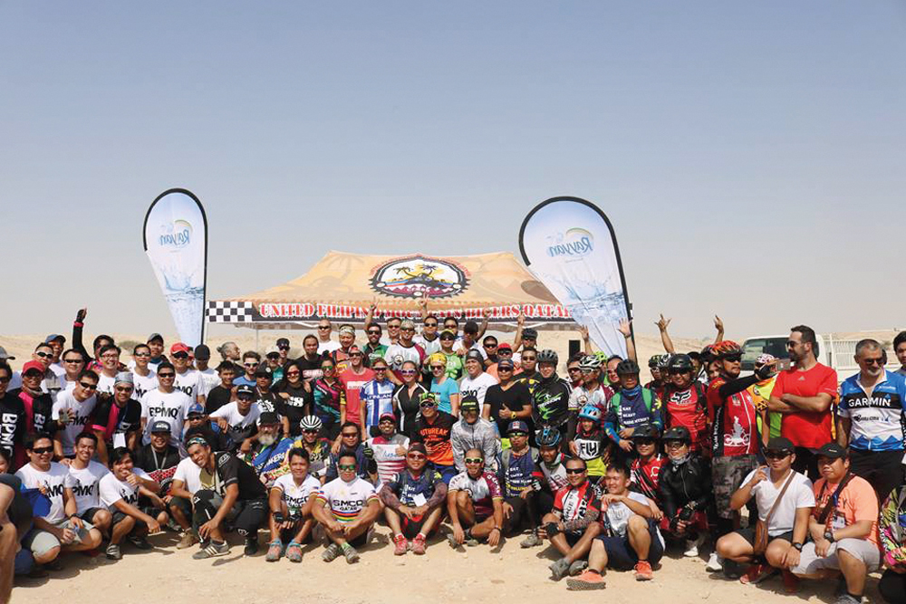 Riders and officials pose for a group photo after the conclusion of first Al Kheesa XCO Race of the Qatar Mountain Bike League (QMBL) season.