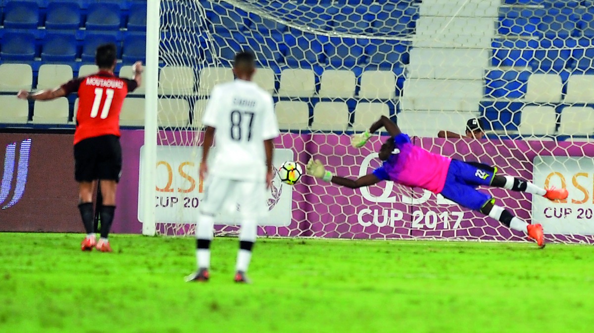 Al Rayyan player Mohssine Moutuali (left) scores from the penalty spot against Al Sadd in their QSL Cup yesterday.
