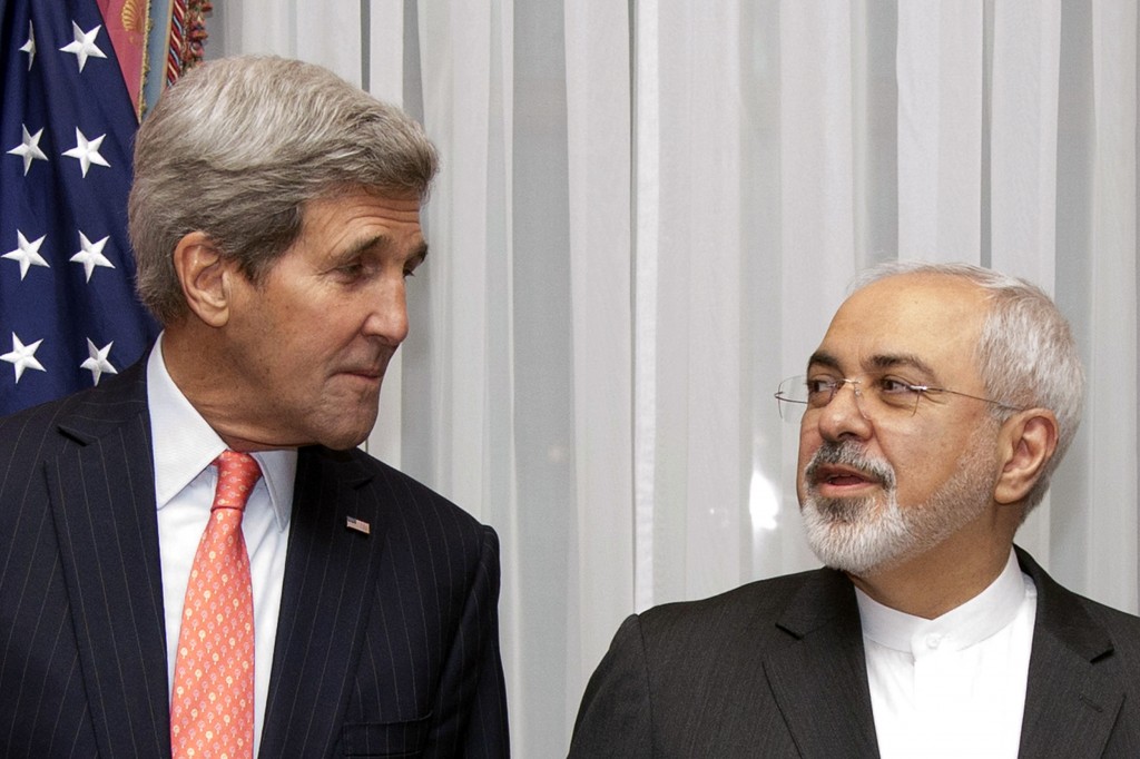 Secretary of State John Kerry (L) and Iran’s Foreign Minister Mohammad Javad Zarif pose before resuming talks in Lausanne, March 16, 2015. Reuters/Brian Snyder