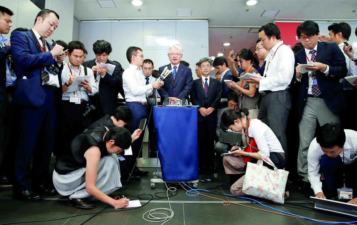 Kobe Steel President and CEO Hiroya Kawasaki (centre) speaks to the media after meeting with Ministry of Economy, Trade and Industry’s Director-General of Manufacturing Industries Bureau, Akihiro Tada at the M ninistry in Tokyo, Japan, yesterday.