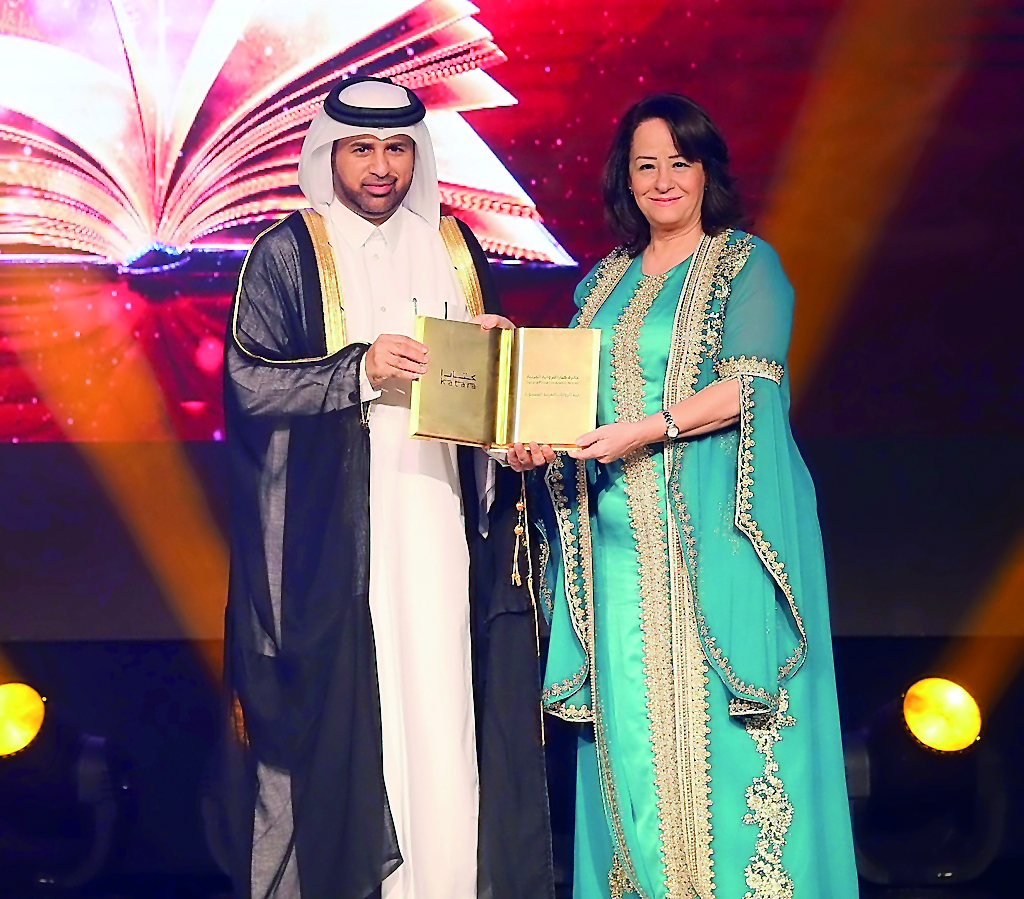 Katara General Manager Dr Khalid bin Ibrahim Al Sulaiti presenting Sameha Kheres, the annual Katara Prizes for Arabic Novel awards at a ceremony held yesterday at Katara.