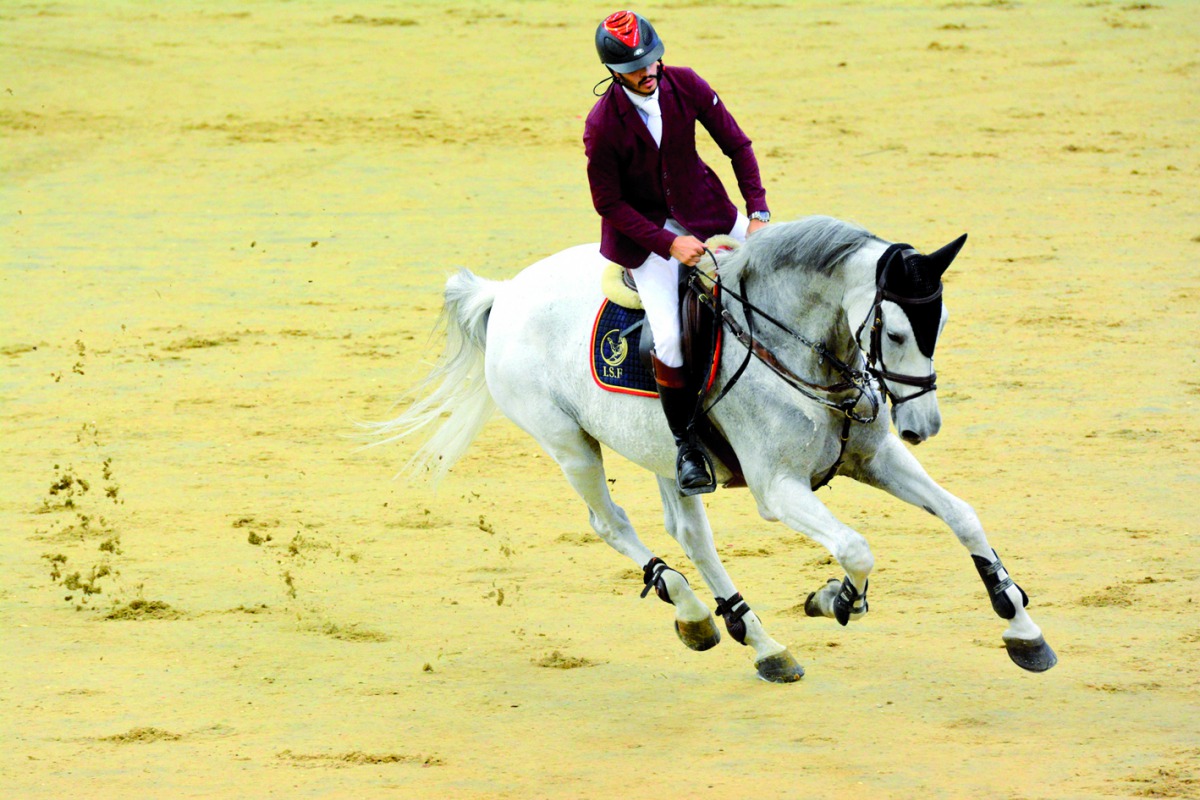 Hamad Nasser Al Qadi, astride SIEC Lonnie, in action during the feature competition - 130/140cm - of the opening round of QR1m ‘Hathab’ showjumping series at Al Shaqab, Indoor Arena yesterday.