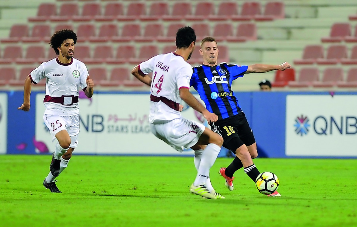 Al Markhiya’s Rebin Ghareeb Solaka (left) and Al Sailiya’s Temurkhuja Abdukholikov vie for the ball possession during their QNB Stars League match.