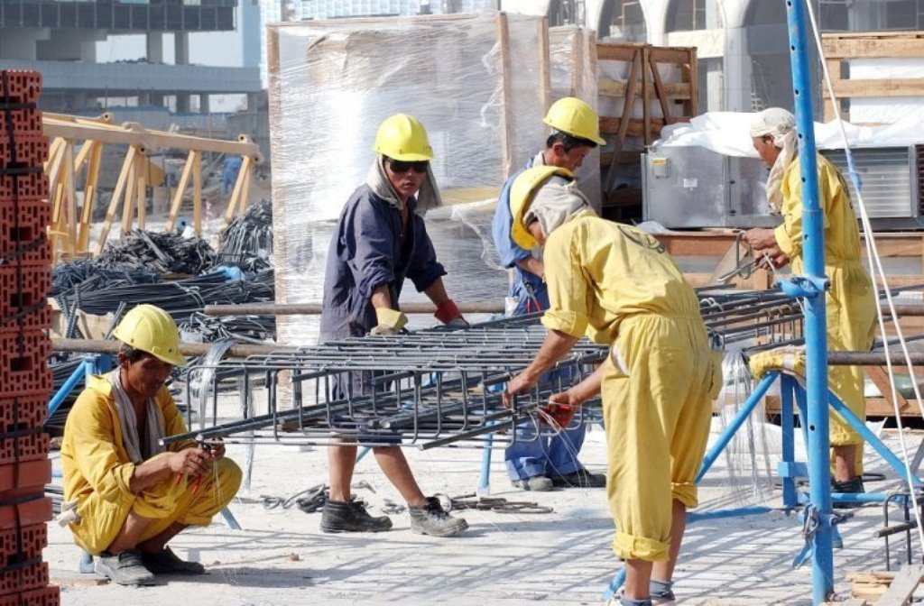 File picture of labourers at a construction site used for representation.