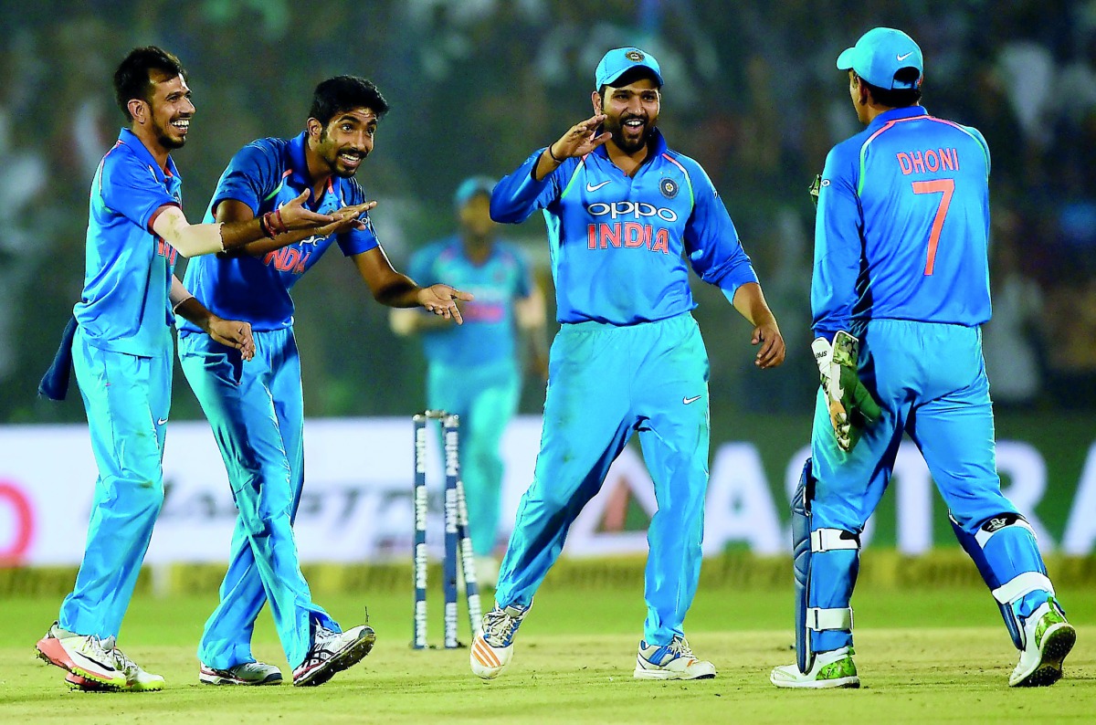 Indian cricketers celebrate after dismissing New Zealand’s Tom Latham during the third and final ODI at the Green Park Cricket Stadium in Kanpur yesterday. 