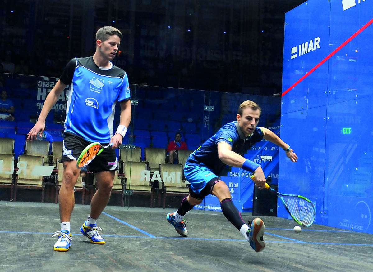 Three-time World Champion Nick Matthew (right) responds to a drop shot from German qualifier Raphael Kandra during their first round match of Qatar Classic 2017 at Khalifa International Tennis and Squash Glasscourt yesterday. Pictures: Anvar Sadath