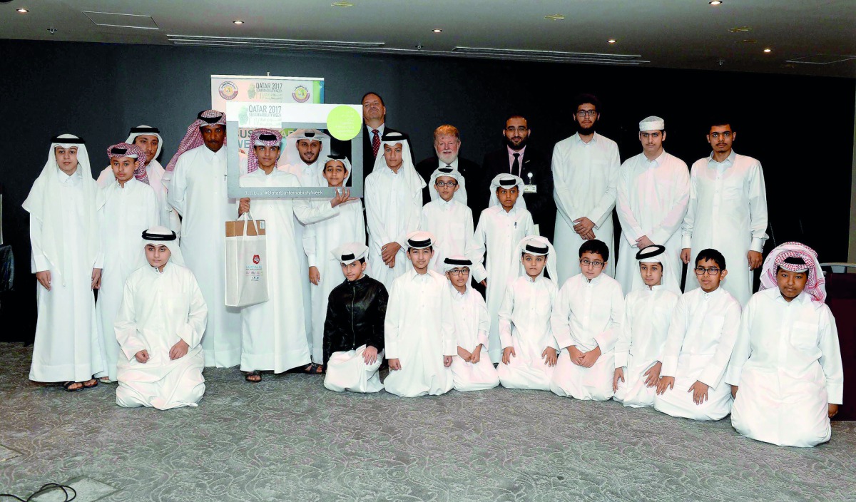 Winners of Al Wakrah-Unesco competition for green sustainability pose with officials. 