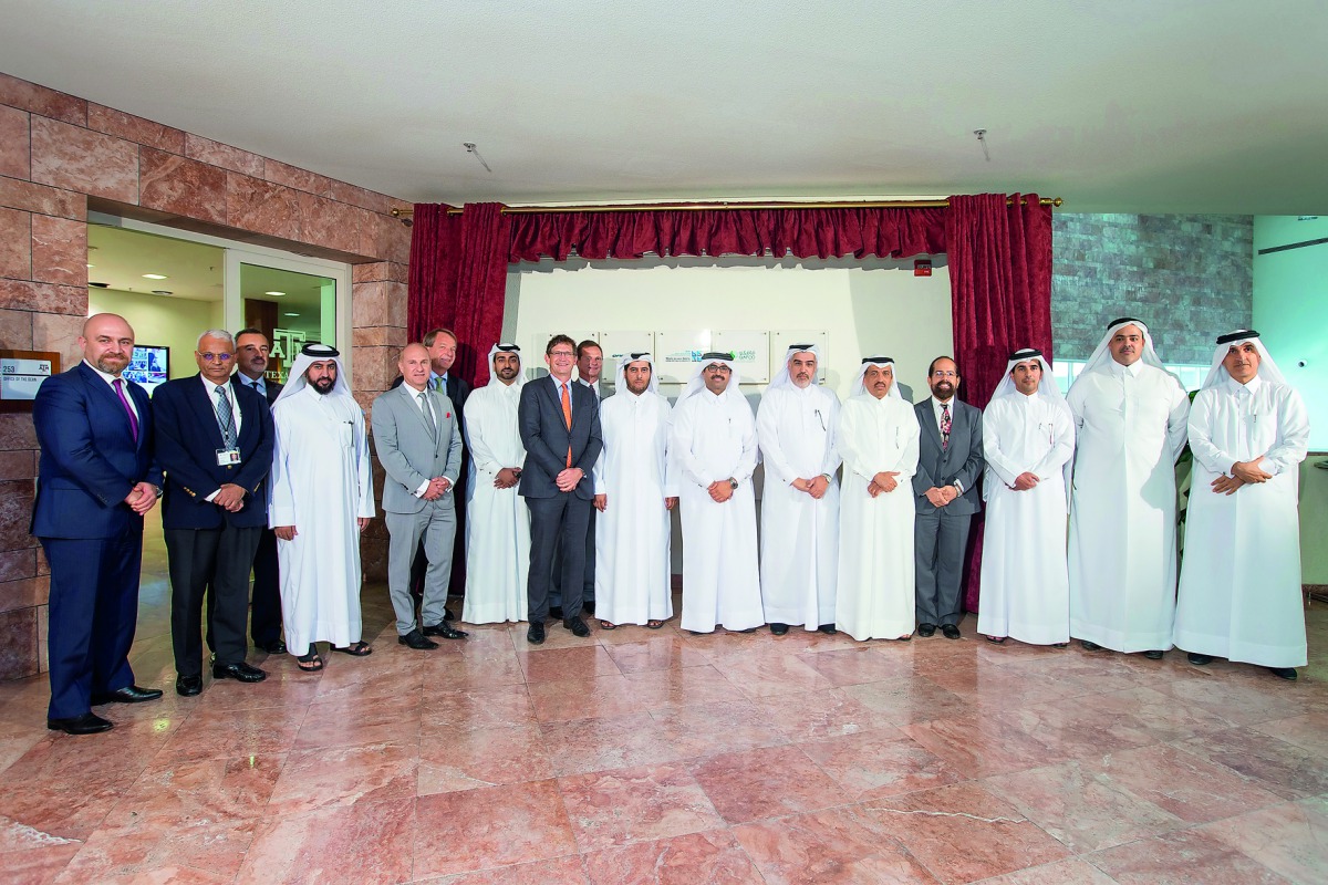 Minister of Energy and Industry H E Dr Mohammed bin Saleh Al Sada with officials representing various partners of Texas A&M University at Qatar, during the ceremony to unveil a new display at the campus. 
