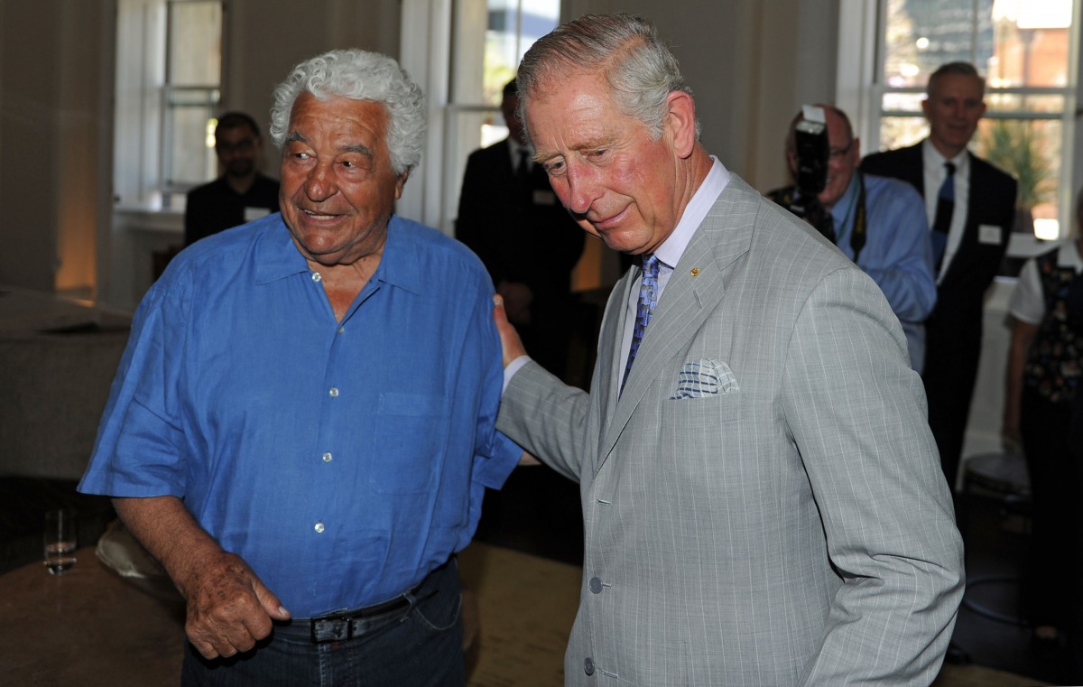 Britain's Prince Charles (R) greeting renowned local chef Antonio Carluccio as he tours the restored historical State Buildings in Perth on November 15, 2015. AFP / Greg Wood