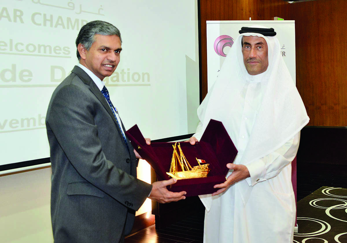 Ali Abdullatif Al Misnad (right), Board Member and Honorary Treasurer  at Qatar Chamber (QC), presenting a memento to India’s Ambassador to Qatar, P Kumaran, at Qatar Chamber  headquarters, yesterday.   