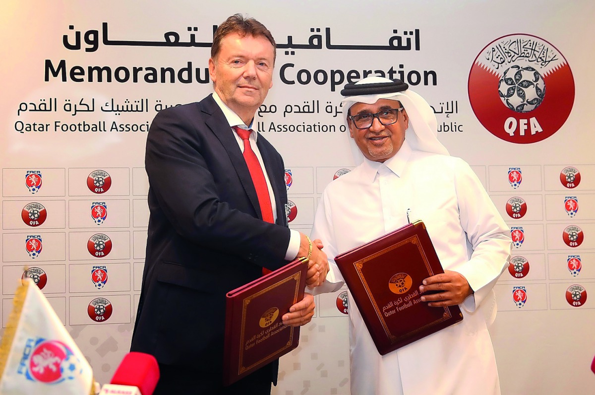 QFA Vice President, Saoud Al Mohannadi, and Roman Berbr, Second Vice President of the FACR, shake hands after the signing ceremony held at Al Bidda Tower yesterday.