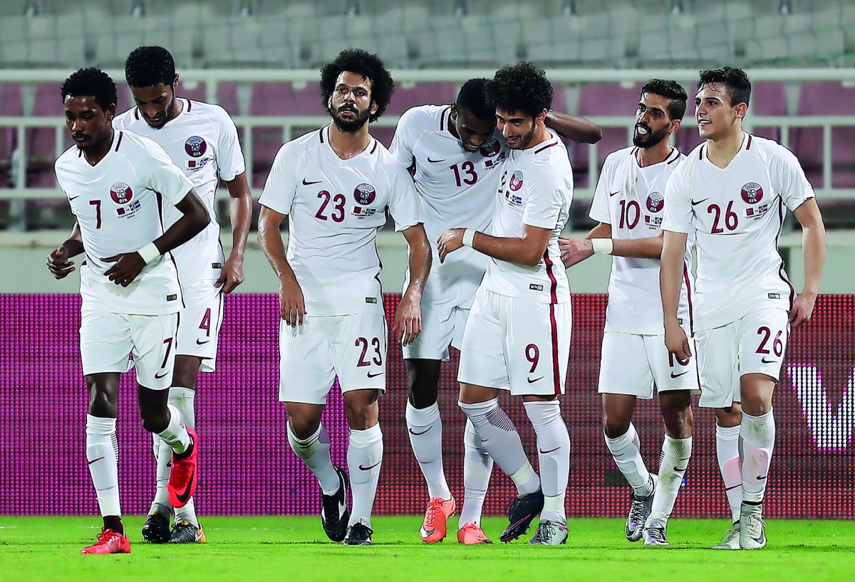 Qatar’s goal scorer Mohammed Muntari (13) celebrates with team-mates after scoring a goal against Iceland in their friendly match at the Abdullah bin Nasser bin Khalifa Stadium yesterday. Qatar drew 1-1 with Iceland.