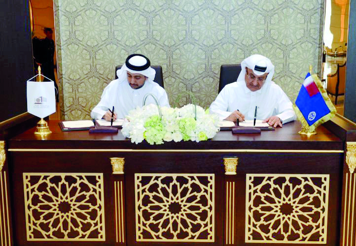 Adviser to the Minister of Interior, Major General Dr. Abdullah Yousuf Al Mal and Vice-President of Supreme Council of Police College and QU President Dr. Hassan Al Derham, sign the MoU.  
