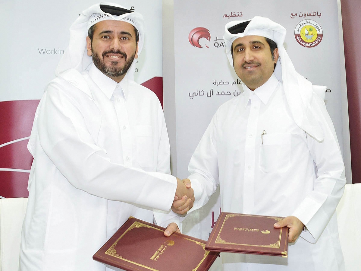 Saleh bin Hamad Al Sharqi (right), QC’s Director General ; and Ali Al Khalifa, ASTAD Chief Executive Officer, during the sponsorship signing event held at Qatar Chamber headquarters, yesterday.