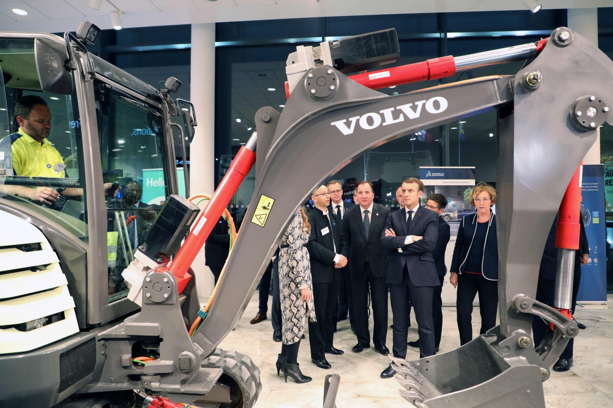 France's President Emmanuel Macron and Sweden's Prime Minister Stefan Lofven speak to employees during a visit to the Volvo Campus Lundby of the Swedish carmaker on the sidelines of the European Social Summit in Gothenburg, Sweden, on November 17, 2017. A