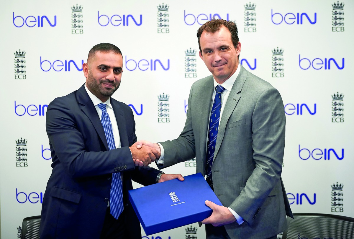 Yousef Al Obaidly (left), Deputy CEO, beIN Media Group and Tom Harrison, CEO of the England and Wales Cricket Board, exchange documents after signing a deal yesterday.