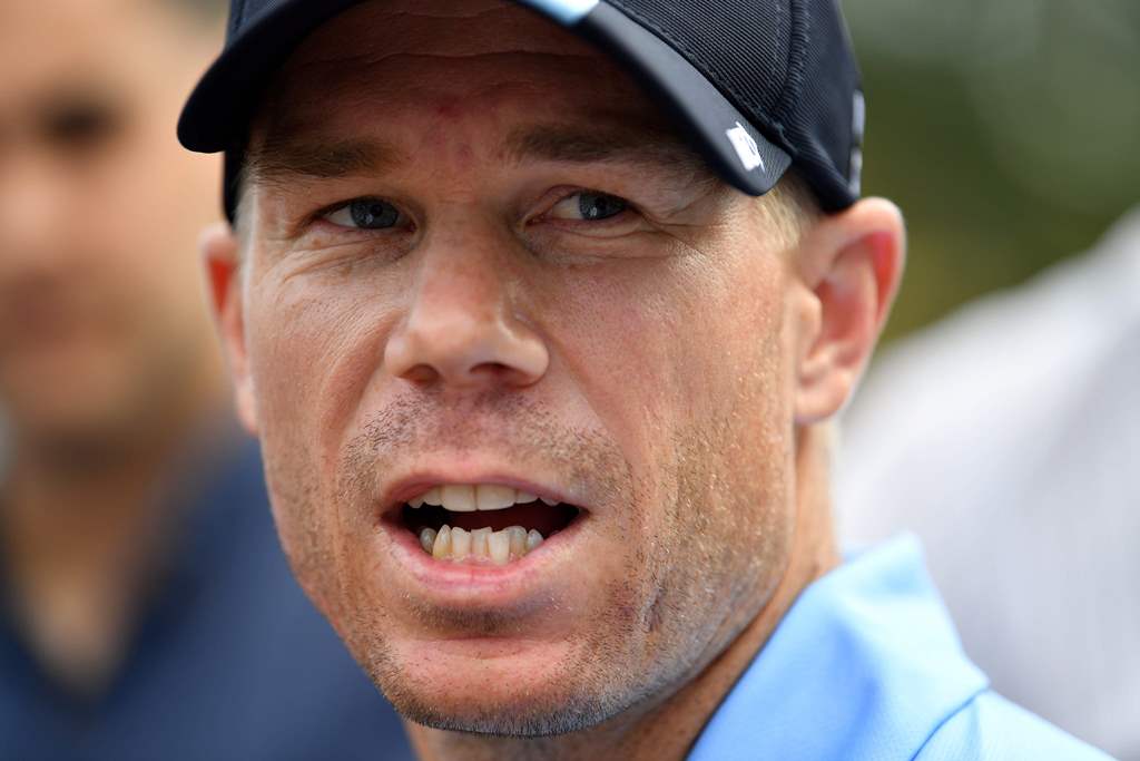 (FILES) This file photo taken on October 24, 2017 shows Australia's cricket team batsman David Warner speaking at a press conference in Sydney. AFP / SAEED KHAN